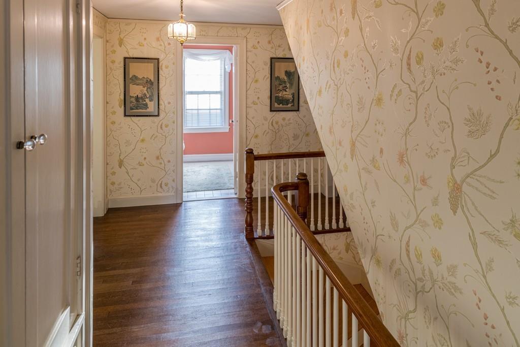 30 Pickwick Road Marblehead, MA 01945 - Photo 10 of 18 a view of a hallway with wooden floor and staircase