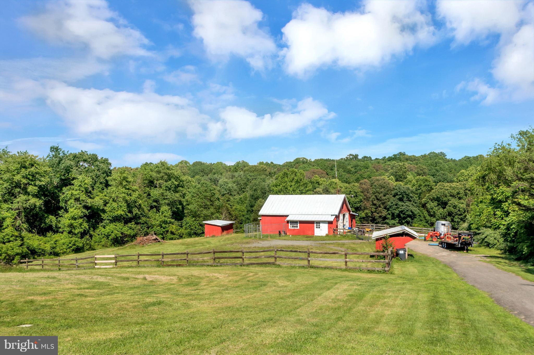 13347 Sillamon Road Goldvein, VA 22720 - Photo 2 of 28 Large barn with multiple stalls and storage sheds!