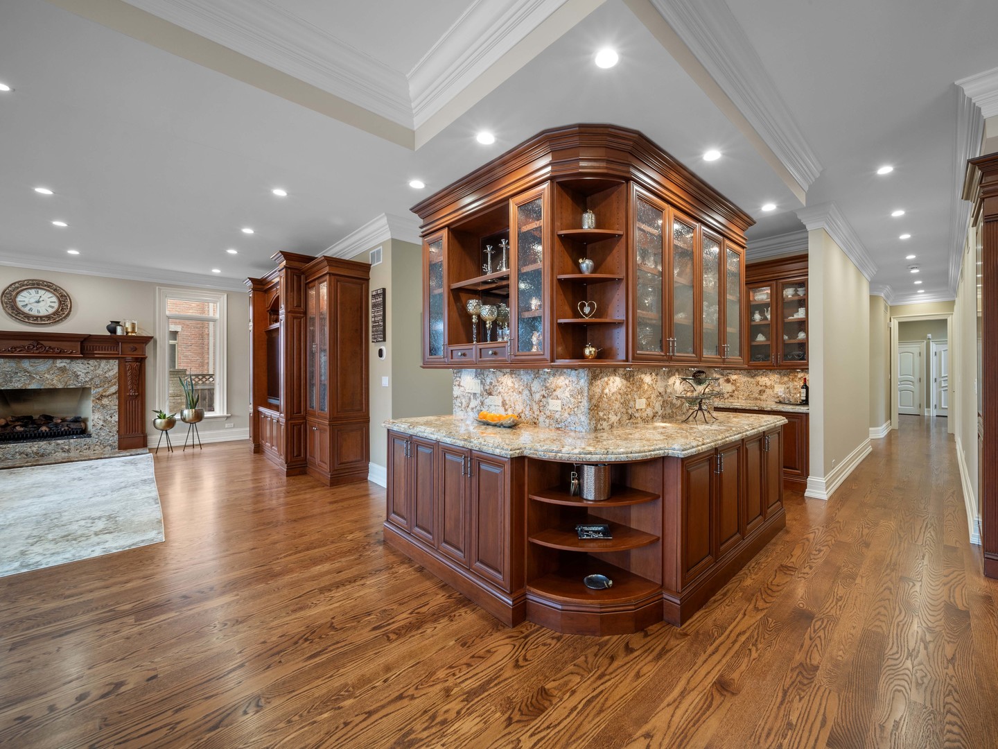 700 Greenwood Road Northbrook, IL 60062 - Photo 16 of 81 a view of kitchen with stainless steel appliances granite countertop a large kitchen island a stove a refrigerator cabinets and a wooden floor