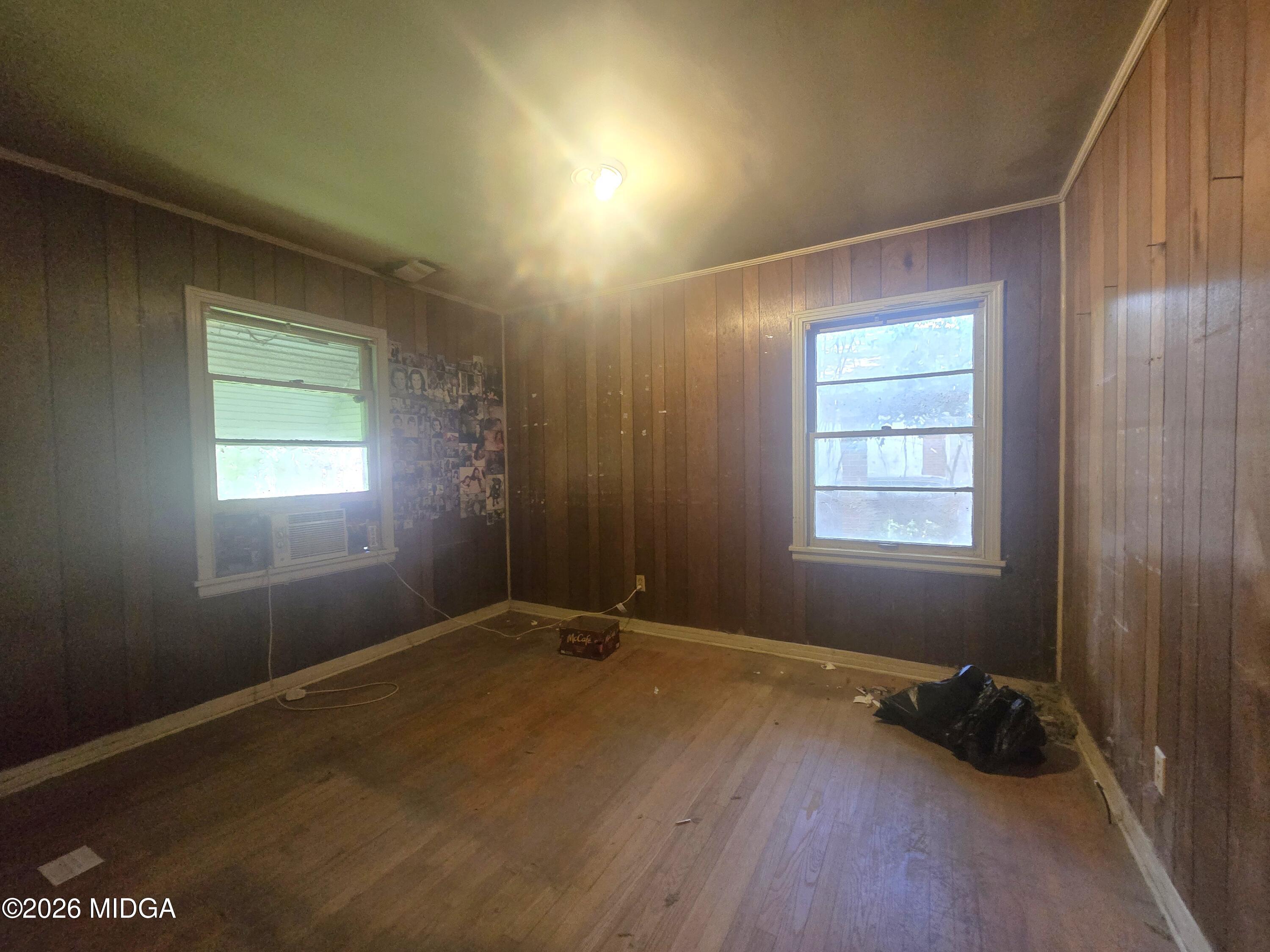 4055 Emory Drive Macon, GA 31206 - Photo 8 of 9 an empty room with windows