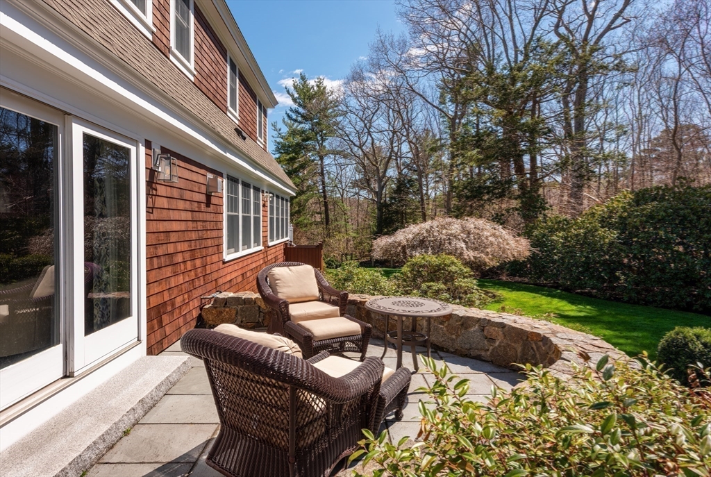 37 Forster Road Manchester, MA 01944 - Photo 11 of 42 a backyard of a house with outdoor seating