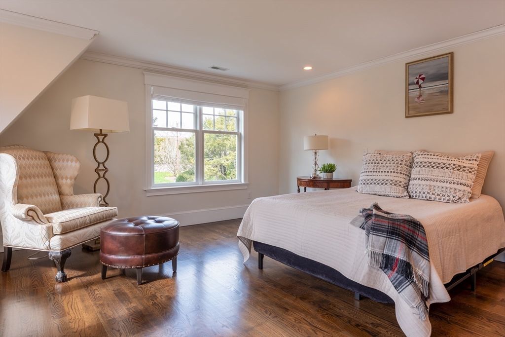 37 Forster Road Manchester, MA 01944 - Photo 31 of 42 a bedroom with a bed and wooden floor