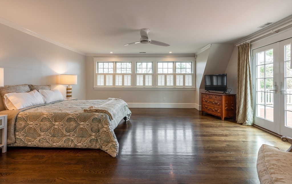 37 Forster Road Manchester, MA 01944 - Photo 33 of 42 a spacious bedroom with a bed and wooden floor