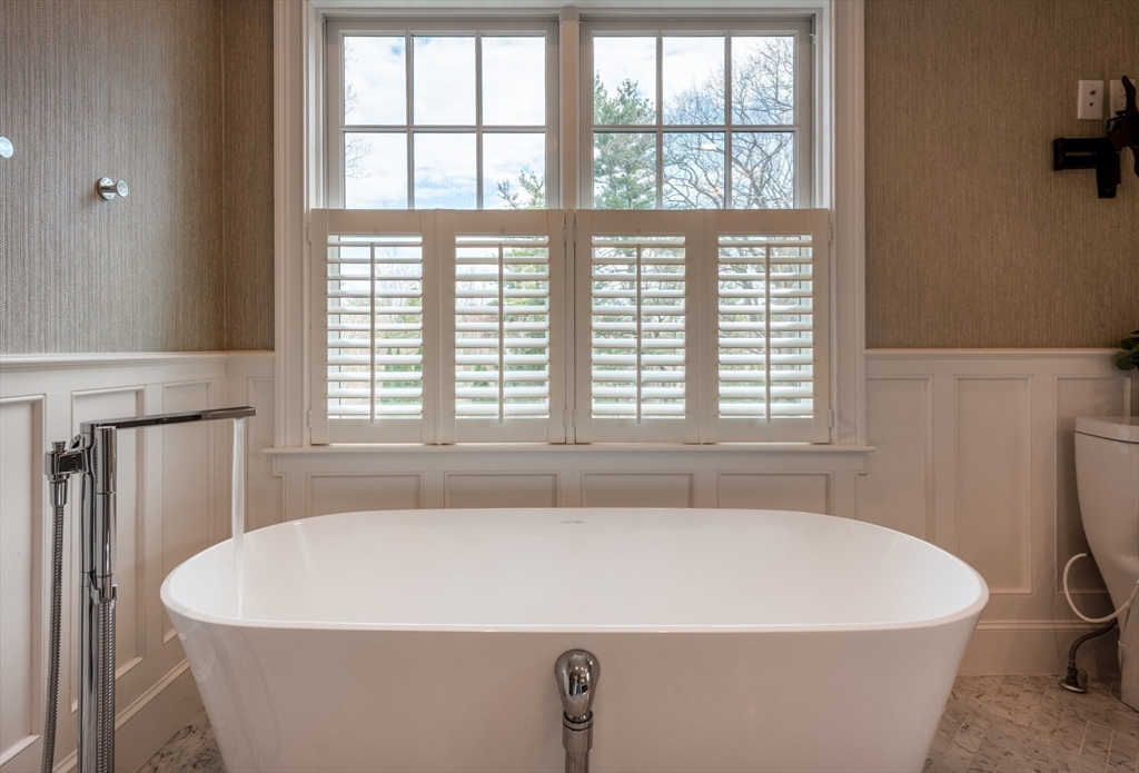 37 Forster Road Manchester, MA 01944 - Photo 38 of 42 a white bath tub sitting in a bathroom next to a window
