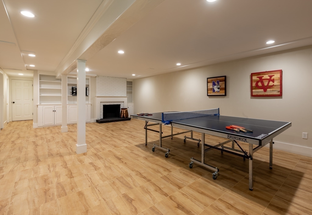 37 Forster Road Manchester, MA 01944 - Photo 41 of 42 a living room with furniture pool table and a flat screen tv