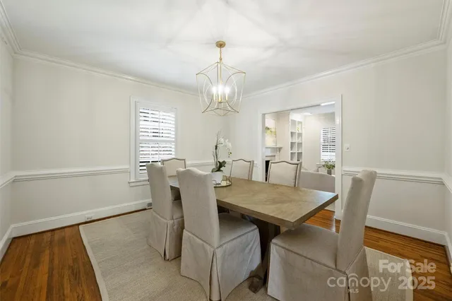 a view of a dining room with furniture and window