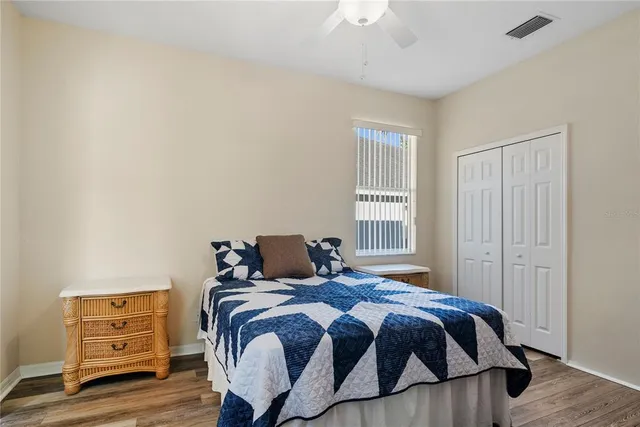 a bedroom with a bed and a closet