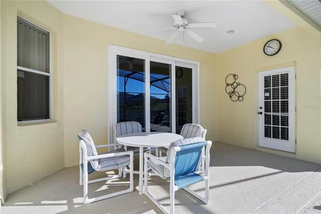 a view of a dining room with furniture and window