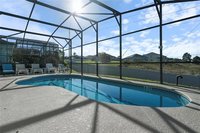 a view of a swimming pool with a porch