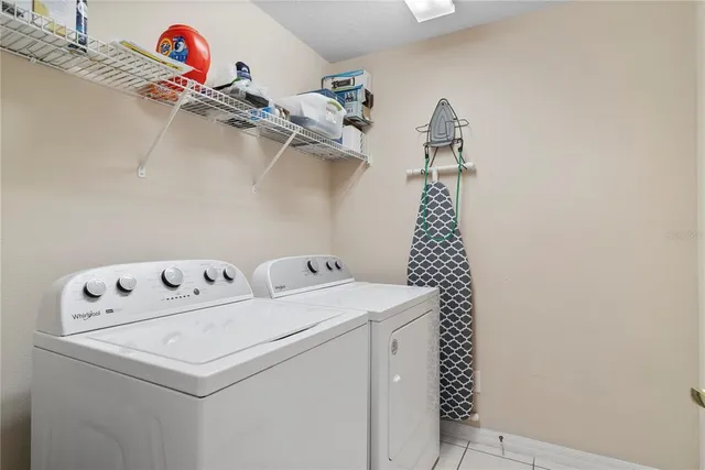 a utility room with dryer and washer