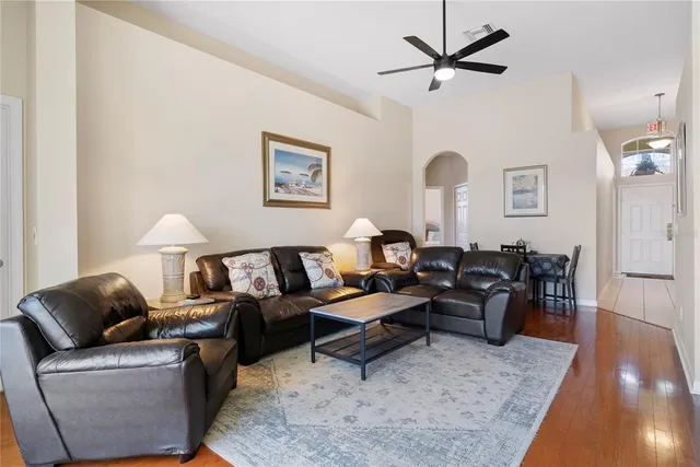 a living room with furniture rug and window