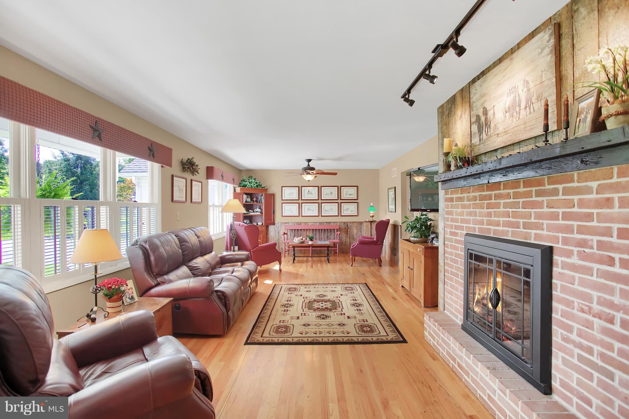 126 Leeds Road Newville, PA 17241 - Photo 6 of 34 Living room w/hardwood floors and fireplace