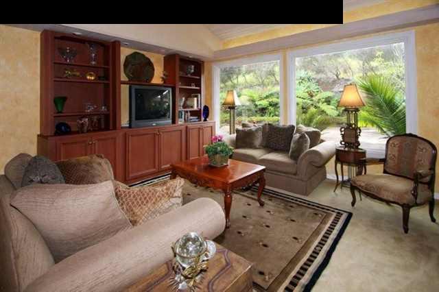 893 Middle Road Kula, HI 96790 - Photo 11 of 24 a living room with furniture and a window