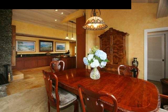 893 Middle Road Kula, HI 96790 - Photo 7 of 24 a view of a dining room with furniture and chandelier
