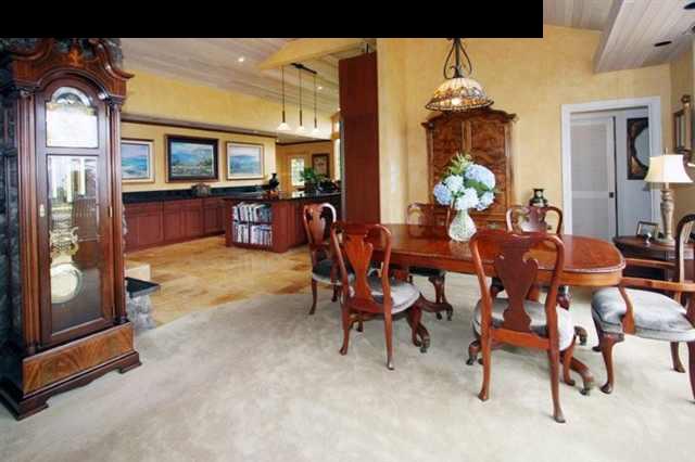 893 Middle Road Kula, HI 96790 - Photo 8 of 24 a view of a dining room with furniture and a chandelier