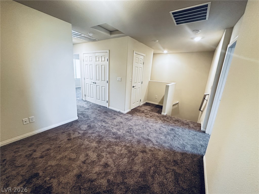 7331 Sunray Point Street North Las Vegas, NV 89084 - Photo 5 of 20 A well-maintained landing area offers plush carpeting and convenient access to adjoining rooms and the staircase.