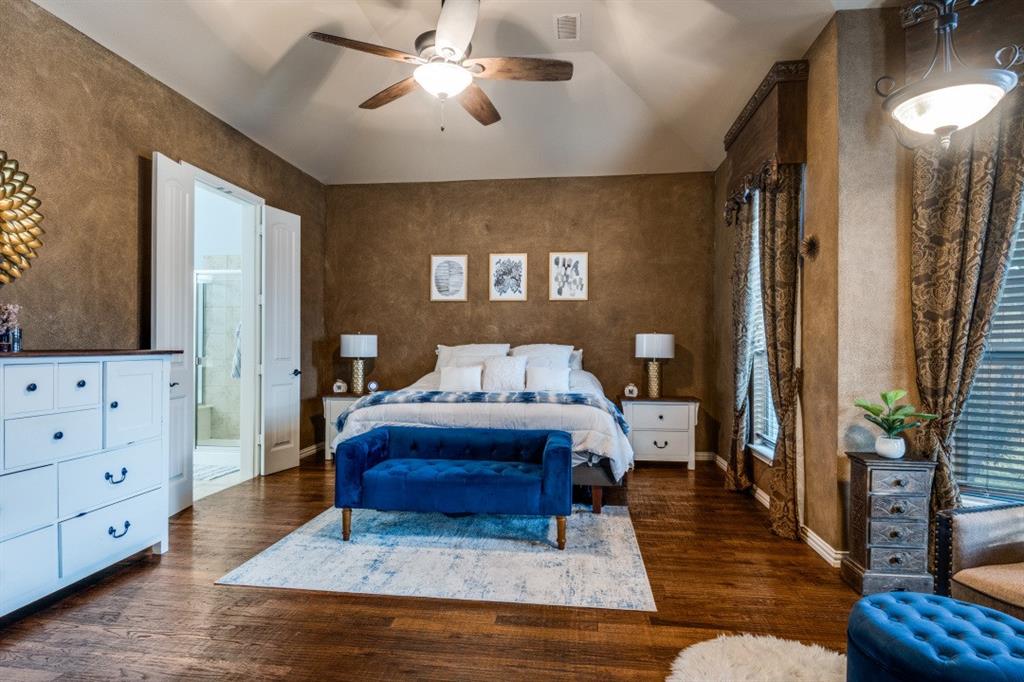 2810 Baker Street Sachse, TX 75048 - Photo 17 of 26 Bedroom with lofted ceiling, dark wood-style flooring, and a ceiling fan