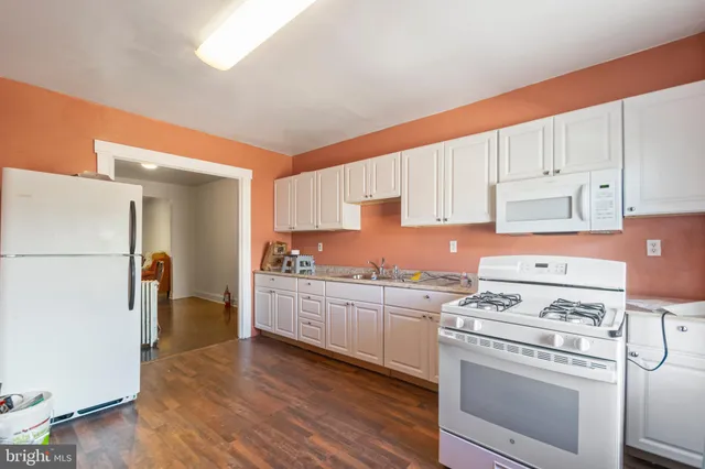 a kitchen with sink cabinets and window