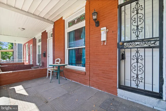 a outdoor space with a couch and a large window