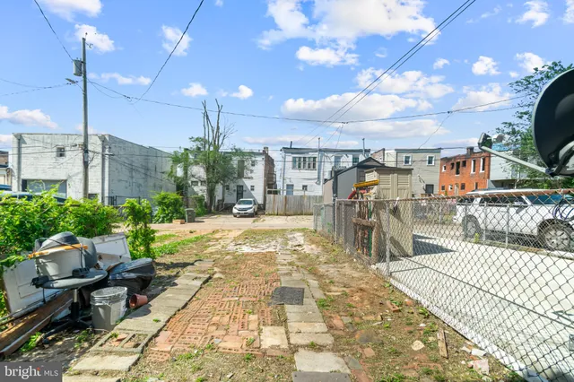 a view of a brick building with many windows