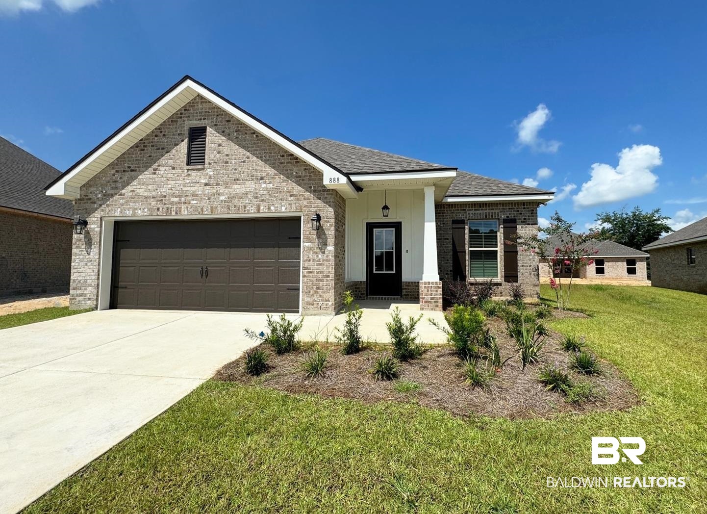 888 Sumter Loop Foley, AL 36535 - Photo 1 of 8 View of front of property with a garage and a front lawn