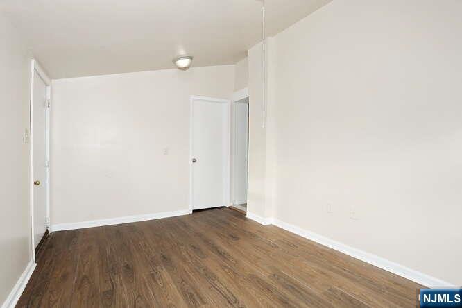 68 Mohawk Avenue, Unit 2 Hawthorne, NJ 07506 - Photo 11 of 24 a view of small space with wooden floor