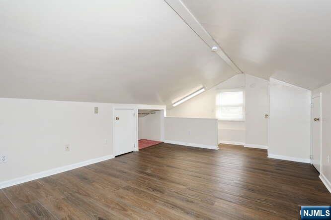 68 Mohawk Avenue, Unit 2 Hawthorne, NJ 07506 - Photo 15 of 24 a view of an empty room with wooden floor