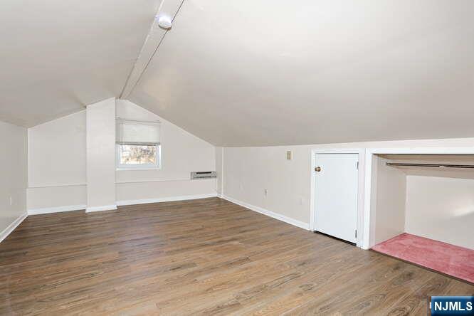 68 Mohawk Avenue, Unit 2 Hawthorne, NJ 07506 - Photo 16 of 24 a view of an empty room with wooden floor and closet