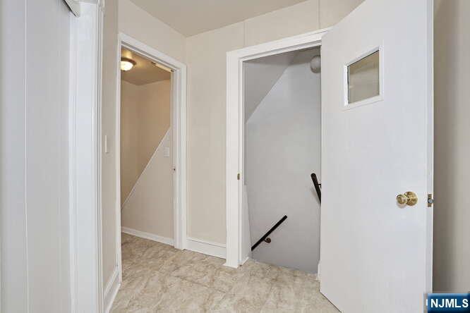 68 Mohawk Avenue, Unit 2 Hawthorne, NJ 07506 - Photo 4 of 24 a view of a hallway with closet and a door