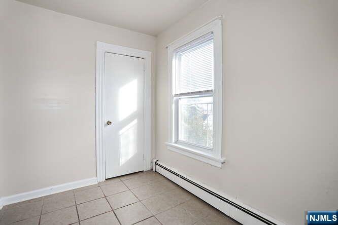 68 Mohawk Avenue, Unit 2 Hawthorne, NJ 07506 - Photo 9 of 24 a view of an empty room and window