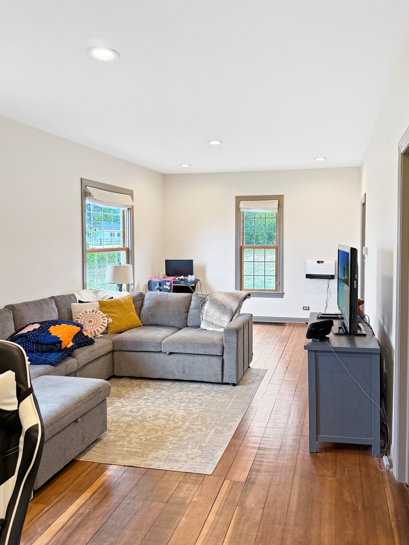 30789 East Five Points Road Kingston, IL 60145 - Photo 12 of 26 a living room with furniture and a flat screen tv
