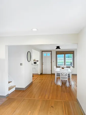 a spacious bedroom with a bed and a flat screen tv