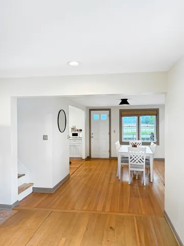 a spacious bedroom with a bed and a flat screen tv