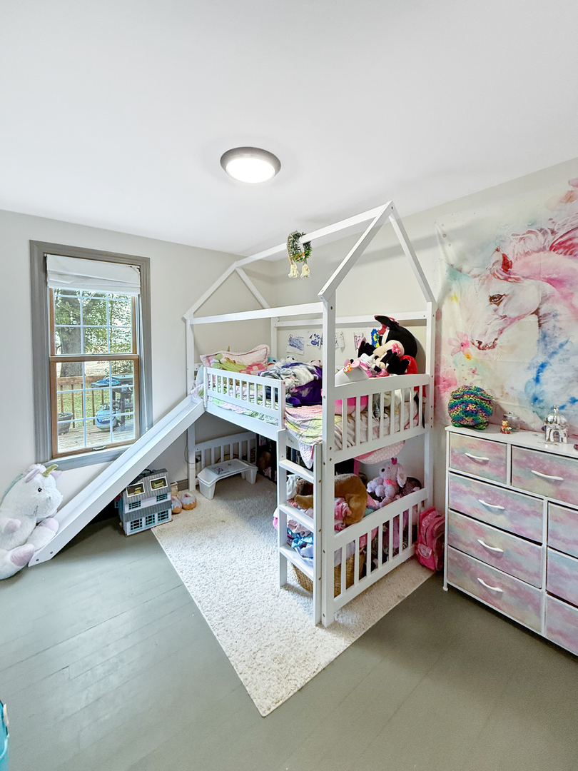 30789 East Five Points Road Kingston, IL 60145 - Photo 19 of 26 a bedroom with a bed and a window