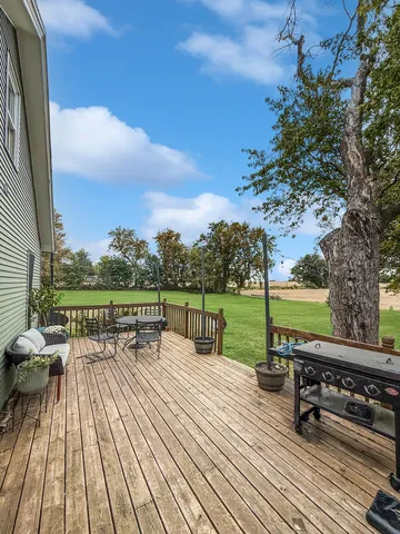 a view of roof deck with patio