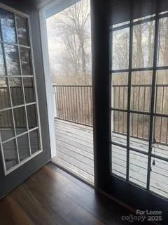 a view of wooden balcony with wooden floor