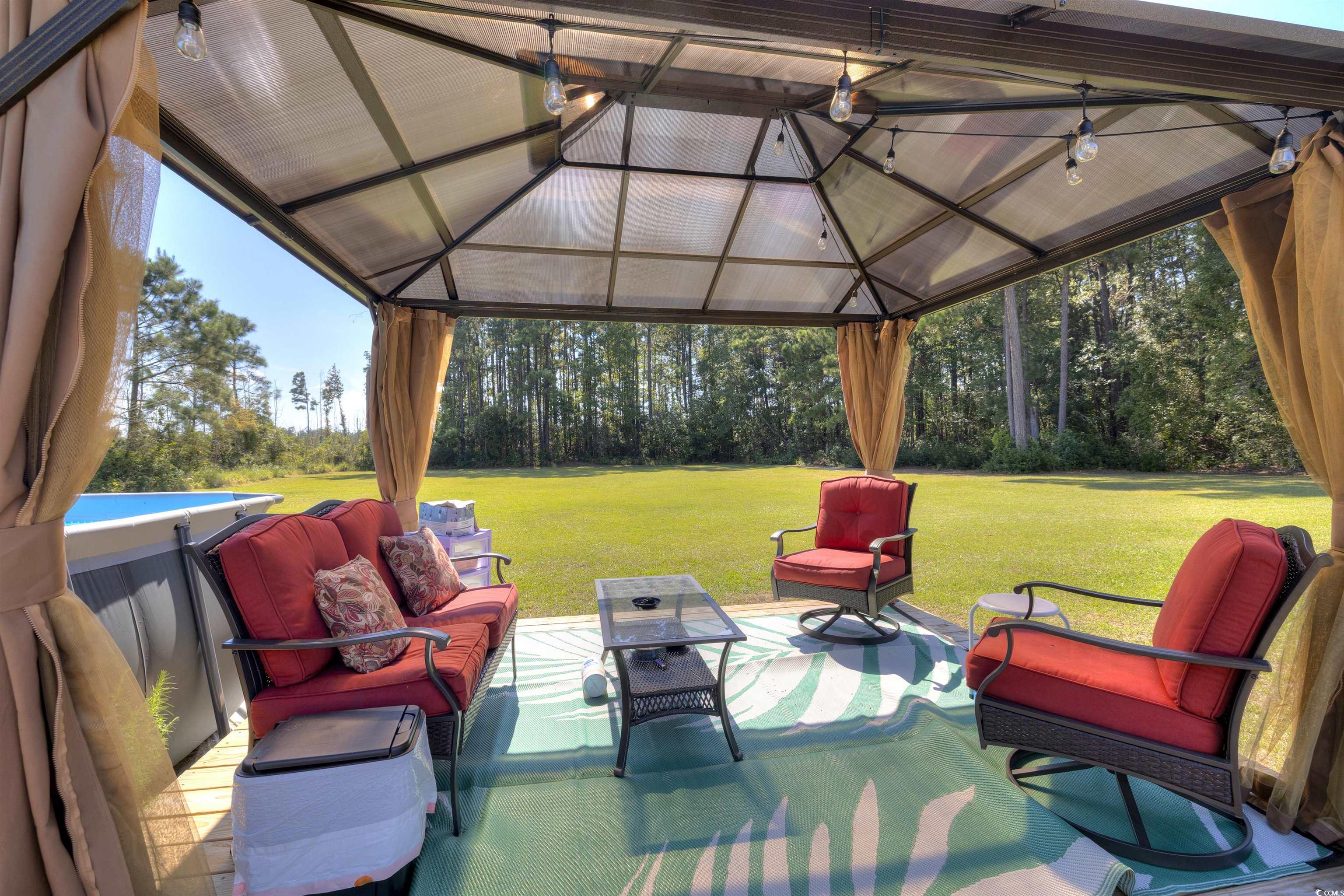 4520 Huggins Road Lake City, SC 29560 - Photo 10 of 40 View of patio featuring outdoor lounge area