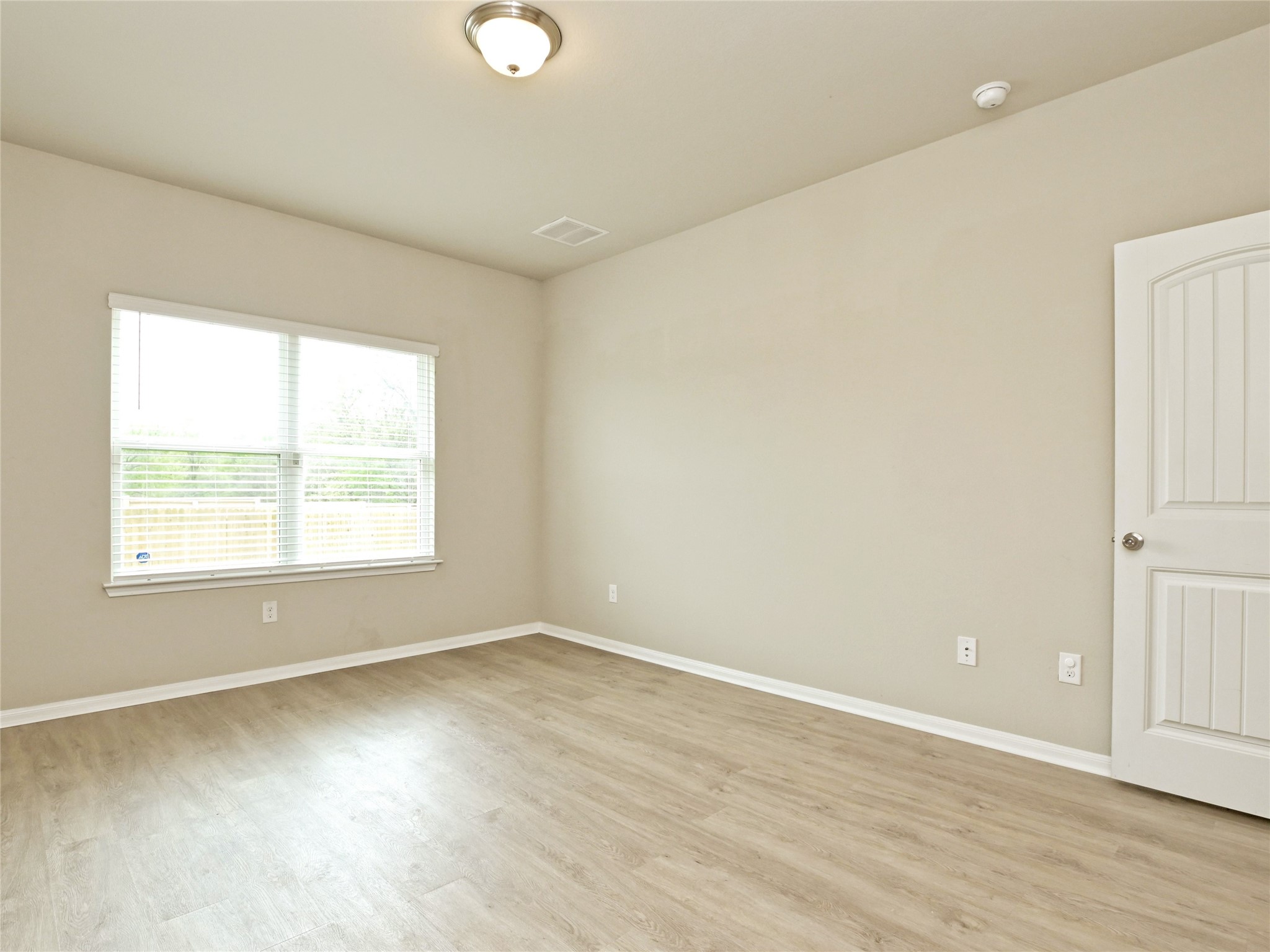 6917 Ranchito Drive Austin, TX 78744 - Photo 15 of 29 Primary Bedroom is on the main floor, with private bath and closet