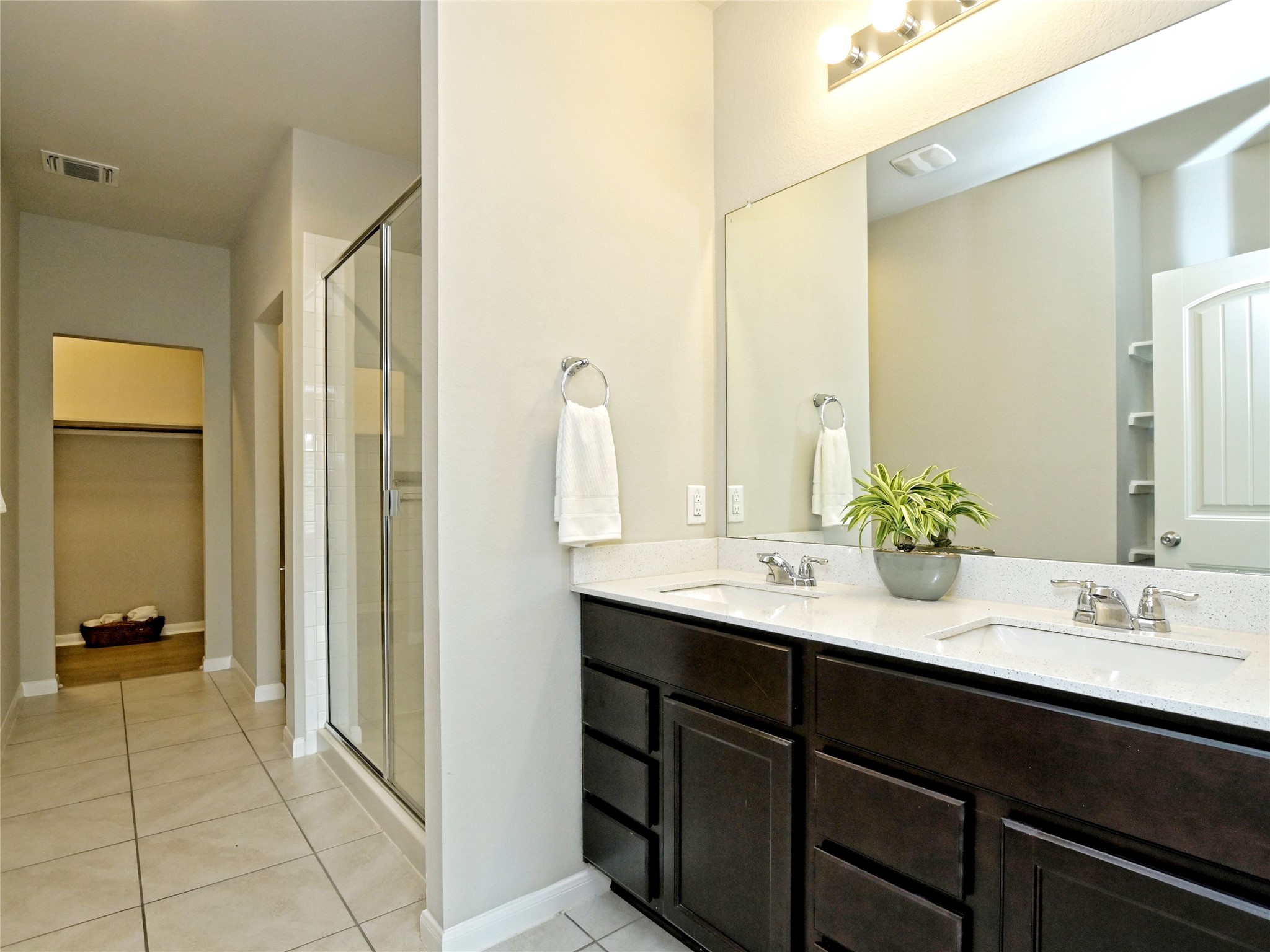 6917 Ranchito Drive Austin, TX 78744 - Photo 17 of 29 Main floor Primary Bathroom with a walk-in shower, also has a large walk-in closet