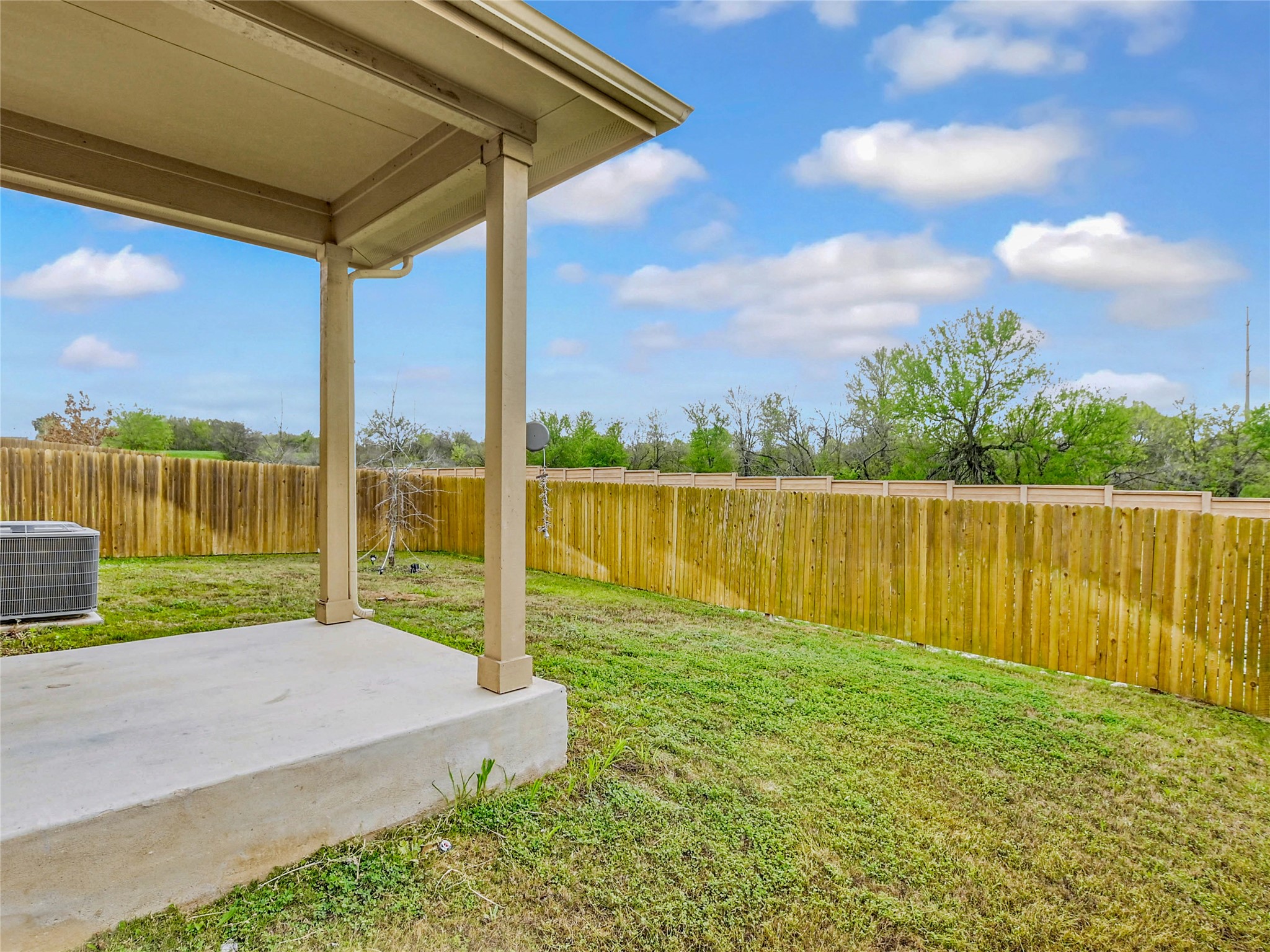 6917 Ranchito Drive Austin, TX 78744 - Photo 25 of 29 Covered patio overlooks the backyard and treed space.