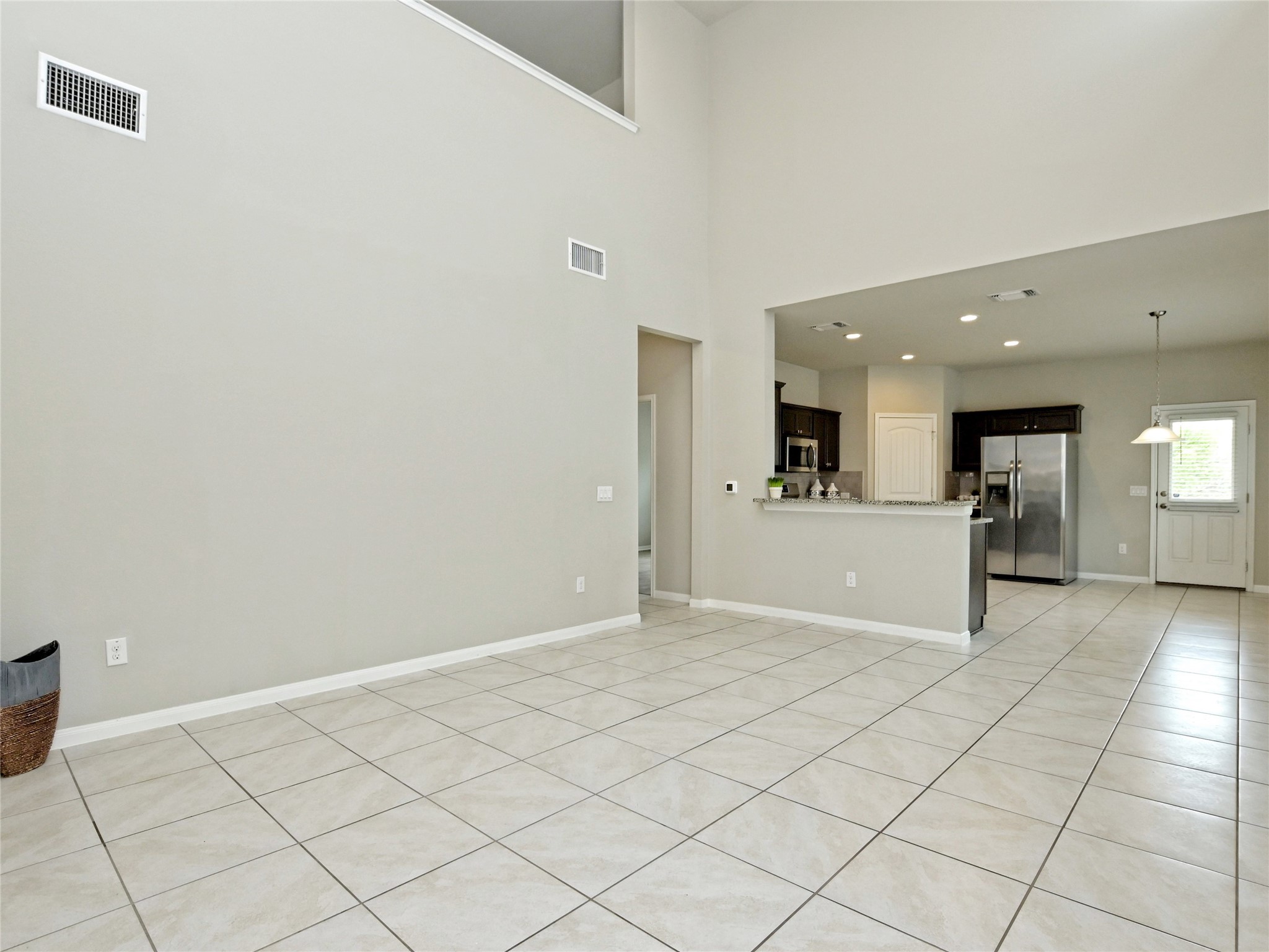 6917 Ranchito Drive Austin, TX 78744 - Photo 3 of 29 Open and inviting, with a a large bright kitchen.