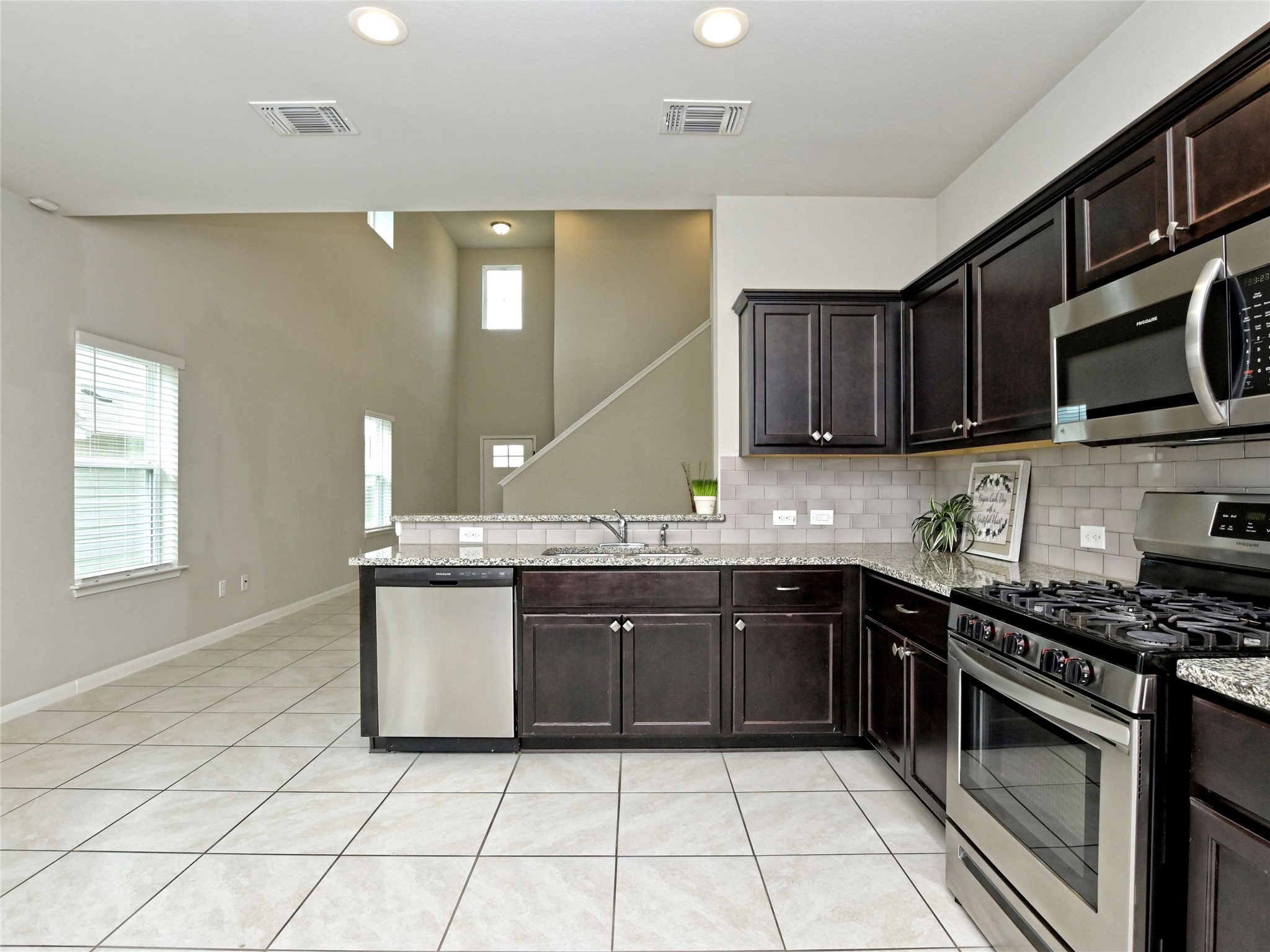 6917 Ranchito Drive Austin, TX 78744 - Photo 7 of 29 Separate enough, yet open to the living area.