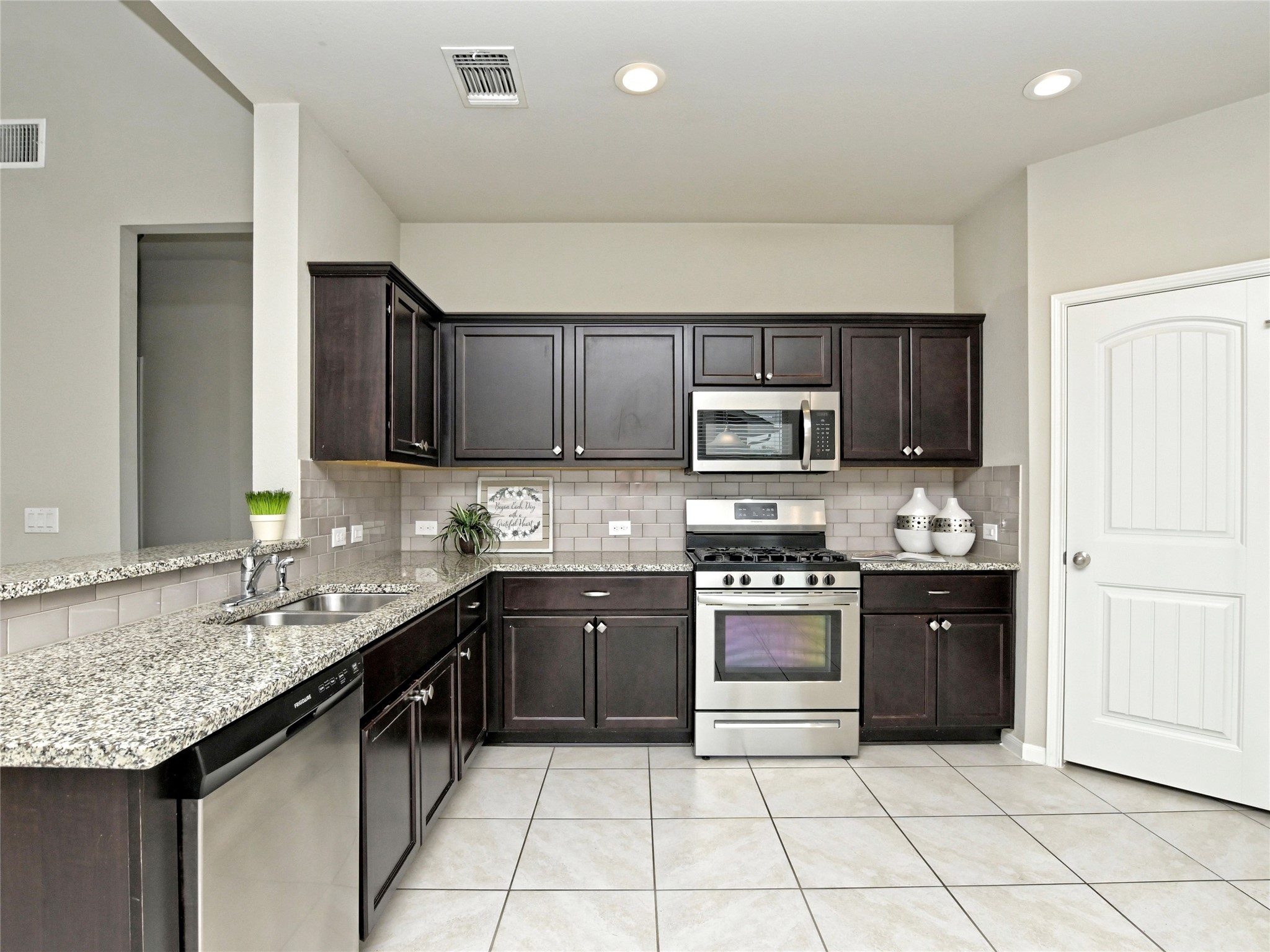 6917 Ranchito Drive Austin, TX 78744 - Photo 8 of 29 Attactive granite counters and stinless appliances