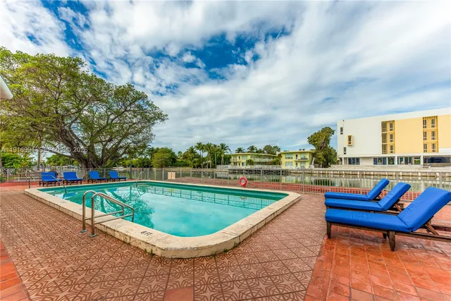a view of swimming pool with a lounge chair