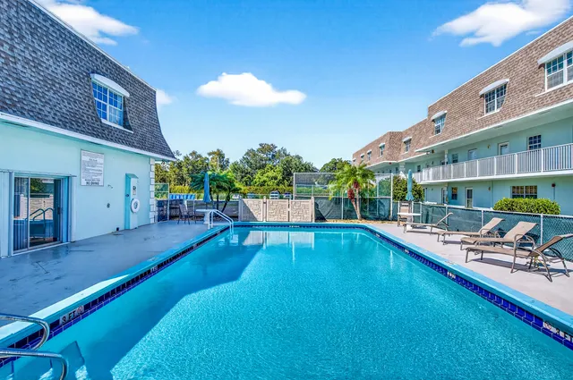 a view of a swimming pool with a patio