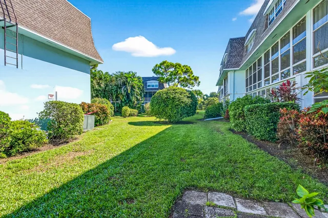 a view of an apartment with a garden