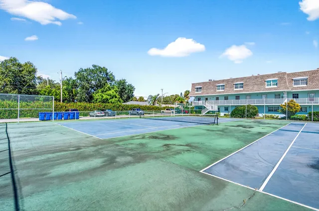 a view of a building with a yard