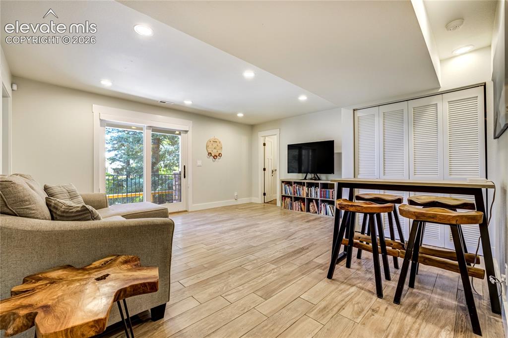 3 Thayer Road Colorado Springs, CO 80906 - Photo 35 of 50 Expansive gathering space ideal for movie nights, entertaining, or extended guest living.