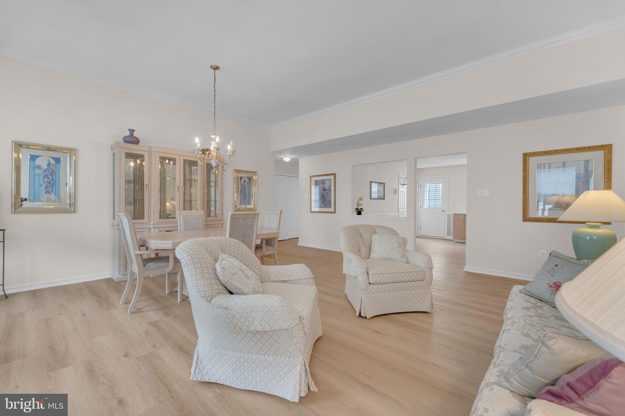 801 Freeport Way Williamstown, NJ 08094 - Photo 7 of 29 a living room with furniture and a chandelier