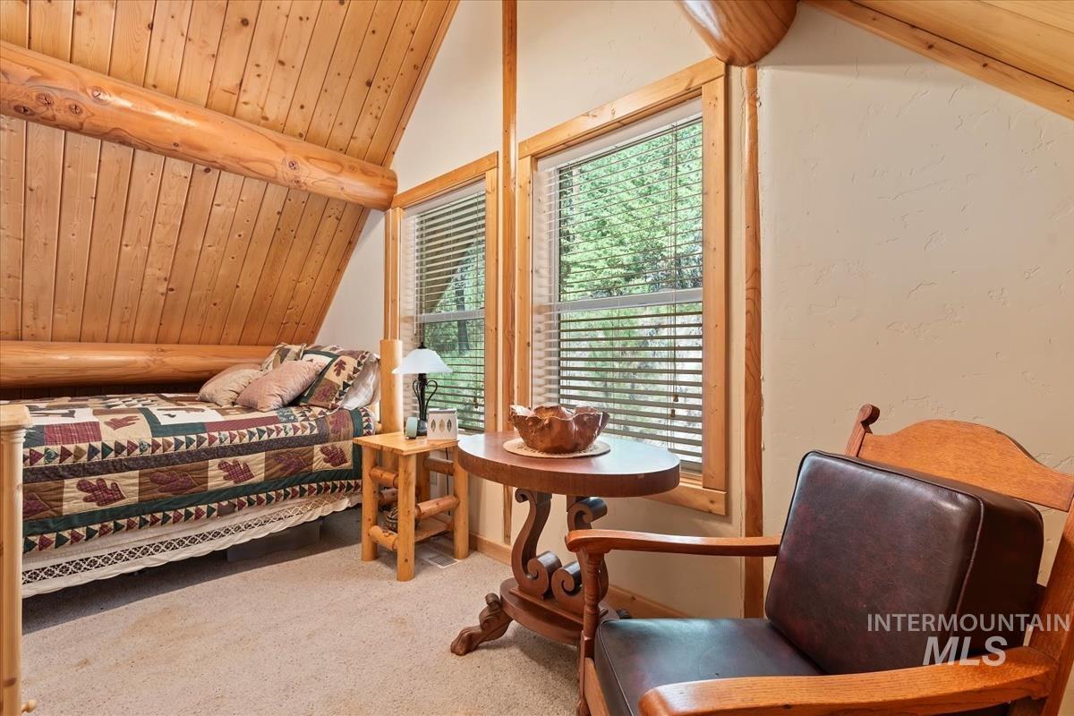 10 Elk Point Road Garden Valley, ID 83622 - Photo 28 of 42 Bedroom with a vaulted wood ceiling and light carpet
